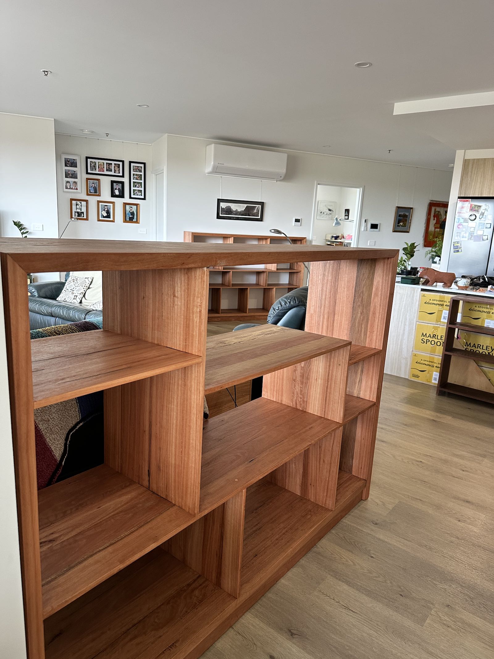 Upcycled Blackbutt bookcase with staggered shelves after white-glove delivery in Giralang ACT