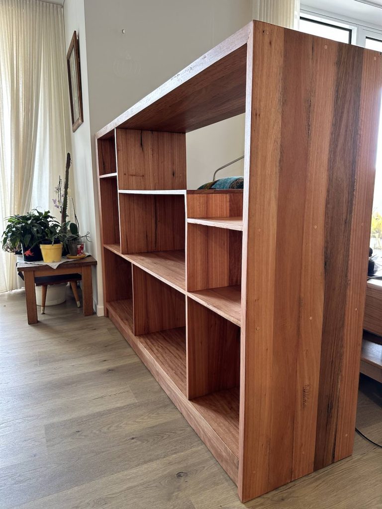 Angled close view of the open Blackbutt bookcase