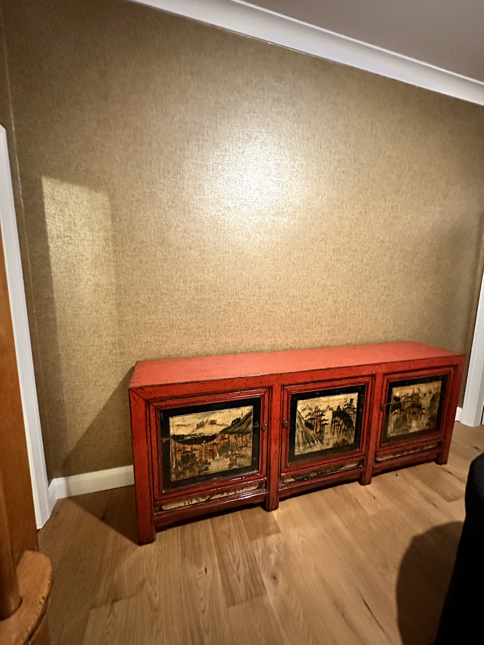 Chinese red-lacquered elm sideboard c.1900 positioned against feature wall after delivery to Manly by Phil’s Furniture Freighters