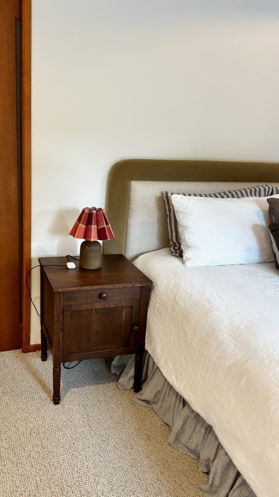 Bedside table finished in a walnut stain beside the bed in the main bedroom, Barwon Heads.