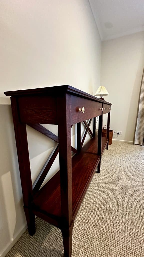 Angled view of the hall stand/sideboard in American Oak with a Jarrah stain tone finish.