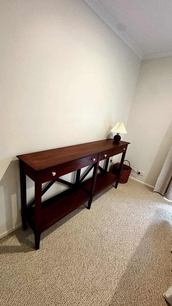Wider view of the hall stand/sideboard in the spare room after delivery.