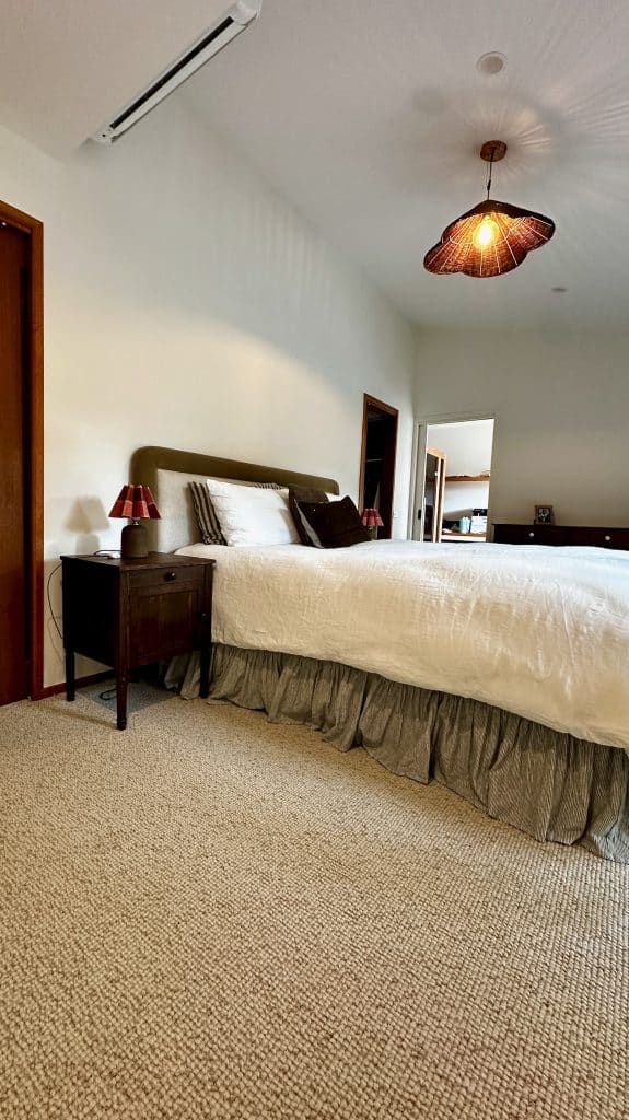 Main bedroom angle showing bedside table and dresser placement in Barwon Heads.