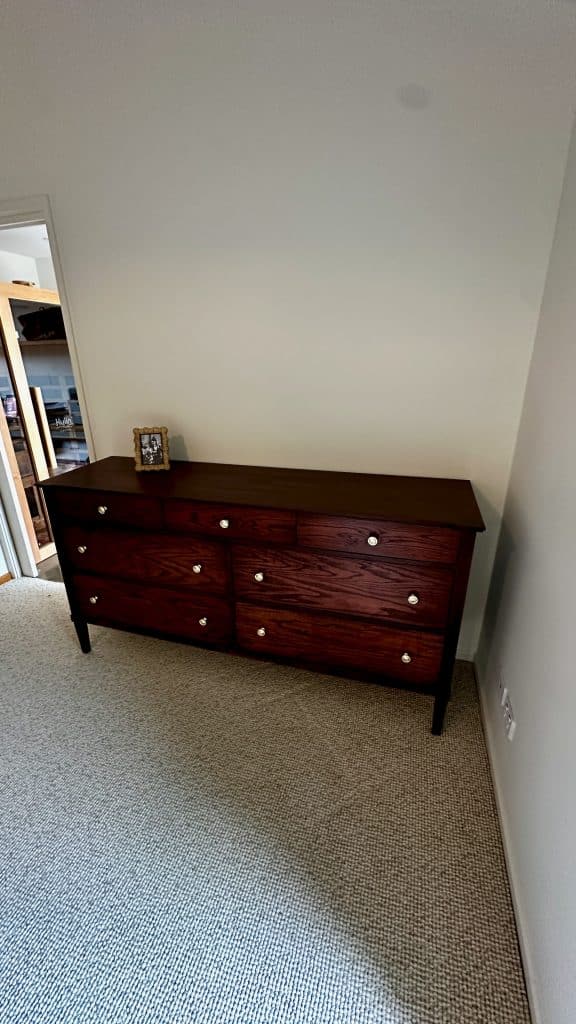 Dresser positioned against the wall in the main bedroom, American Oak with Jarrah stain tone.
