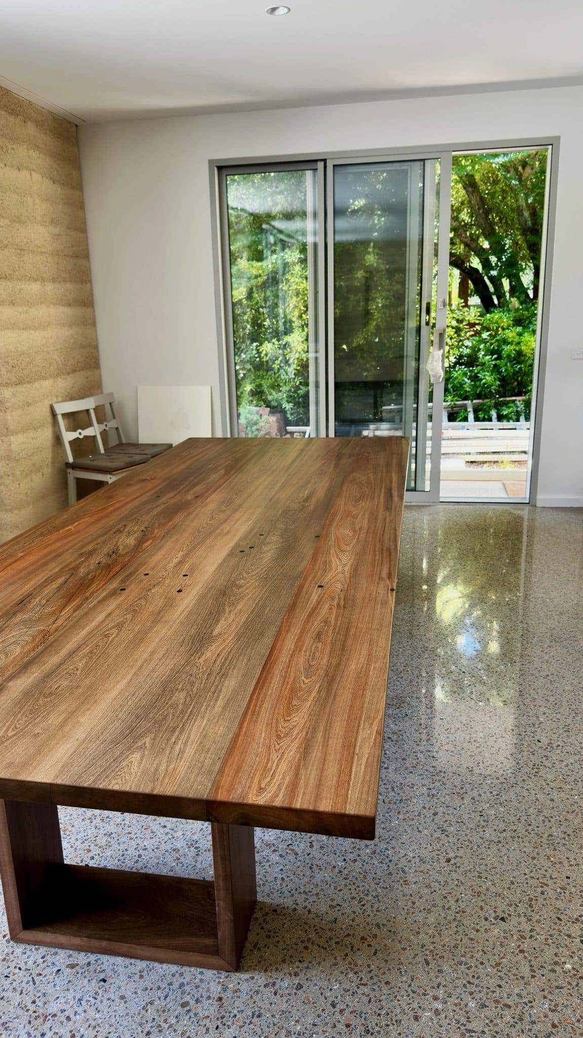 Angled view of the timber dining table top after installation.