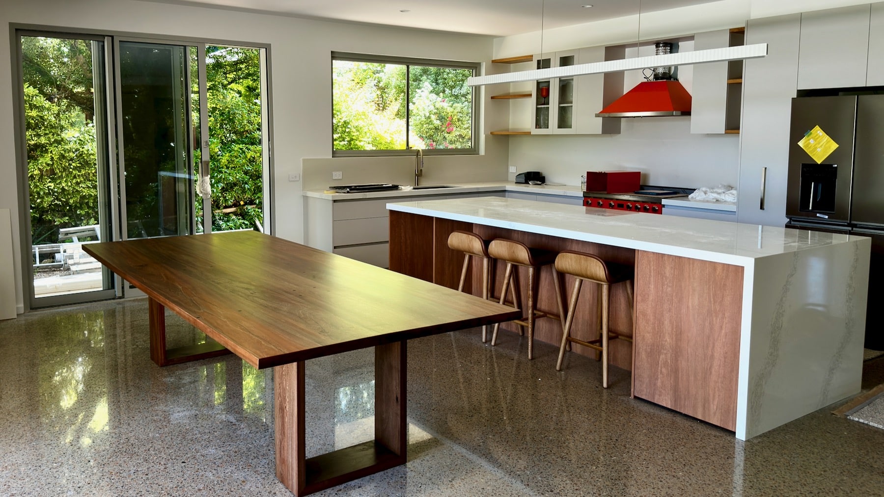 timber dining table in a modern kitchen setting, ready for use.