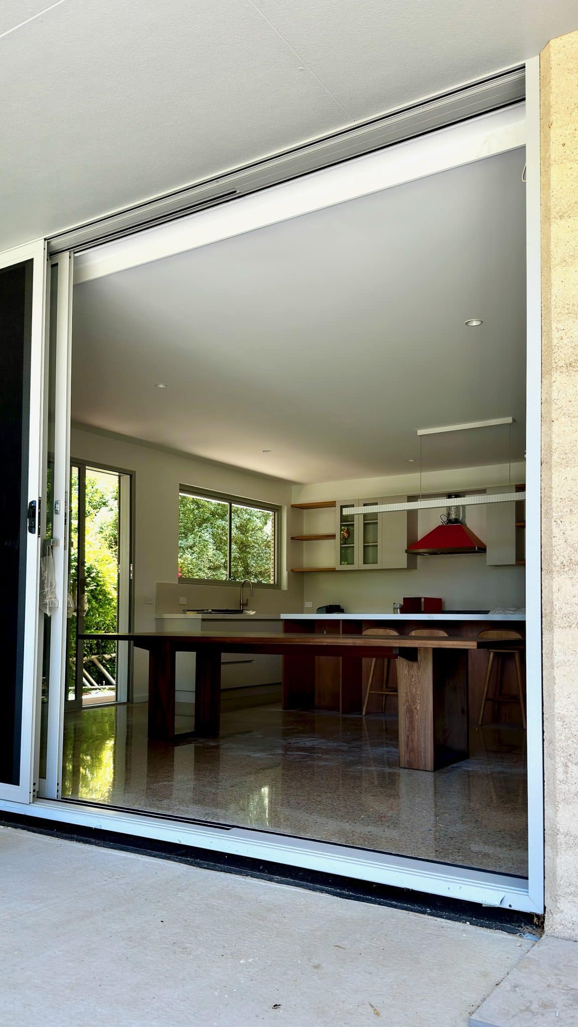 Christian Cole timber dining table positioned in a modern kitchen in Porepunkah.