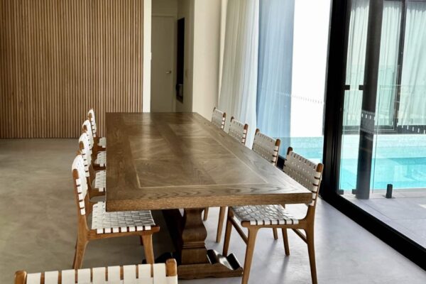 Long dining table by Christian Cole viewed from the end