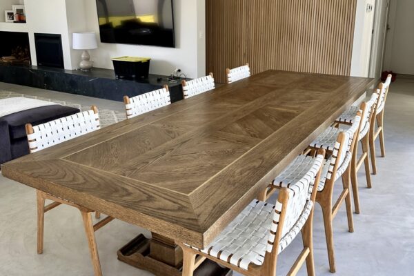 Christian Cole dining table positioned in a bright dining room