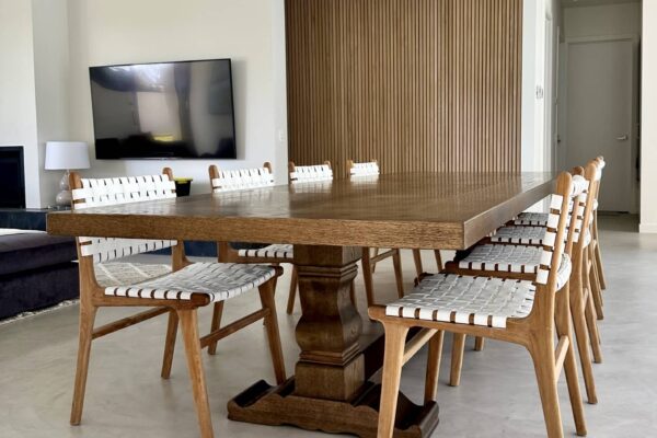 Angled view of a Christian Cole dining table with chairs in Beaumaris, VIC