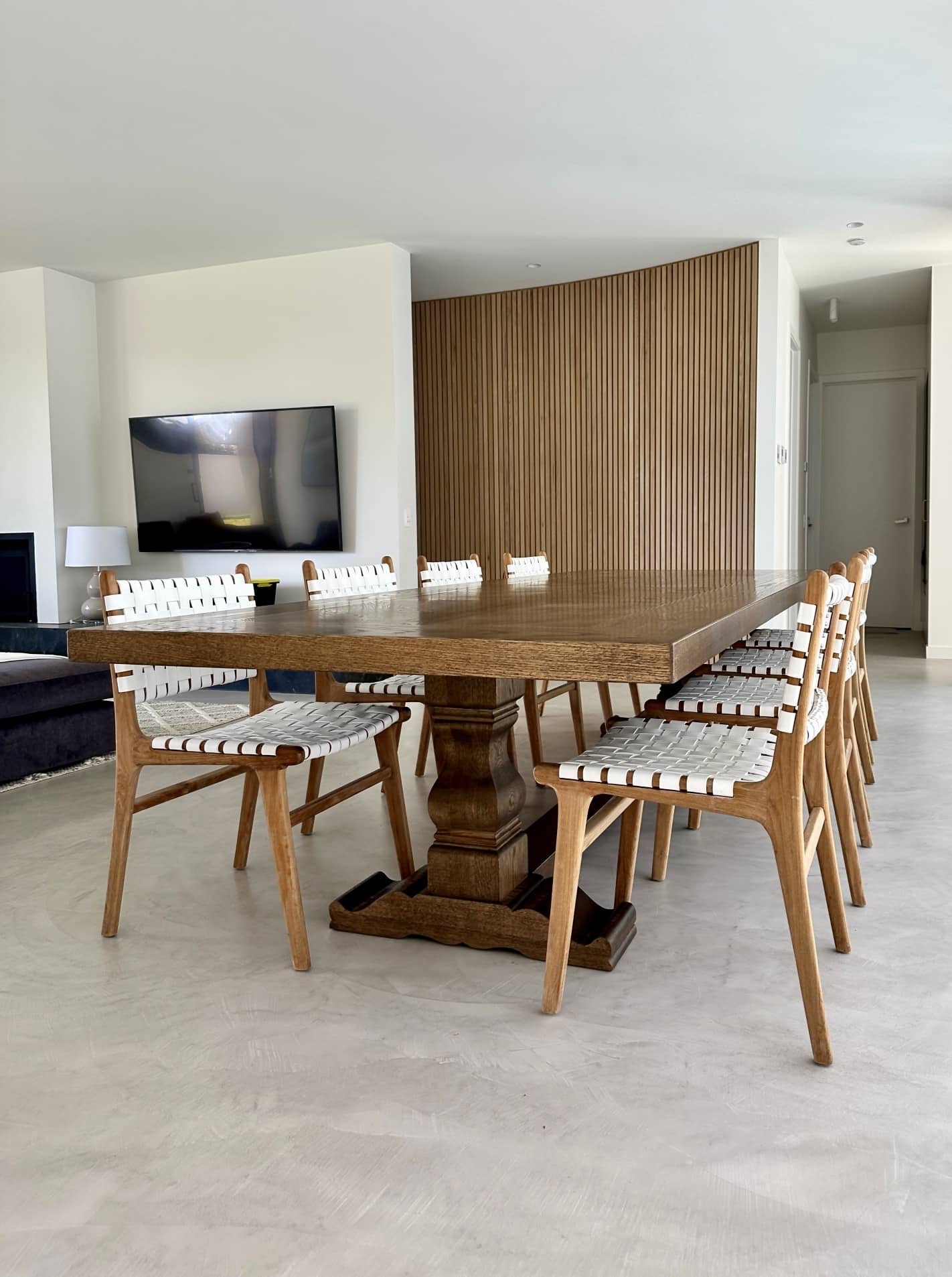 Angled view of a Christian Cole dining table with chairs in Beaumaris, VIC
