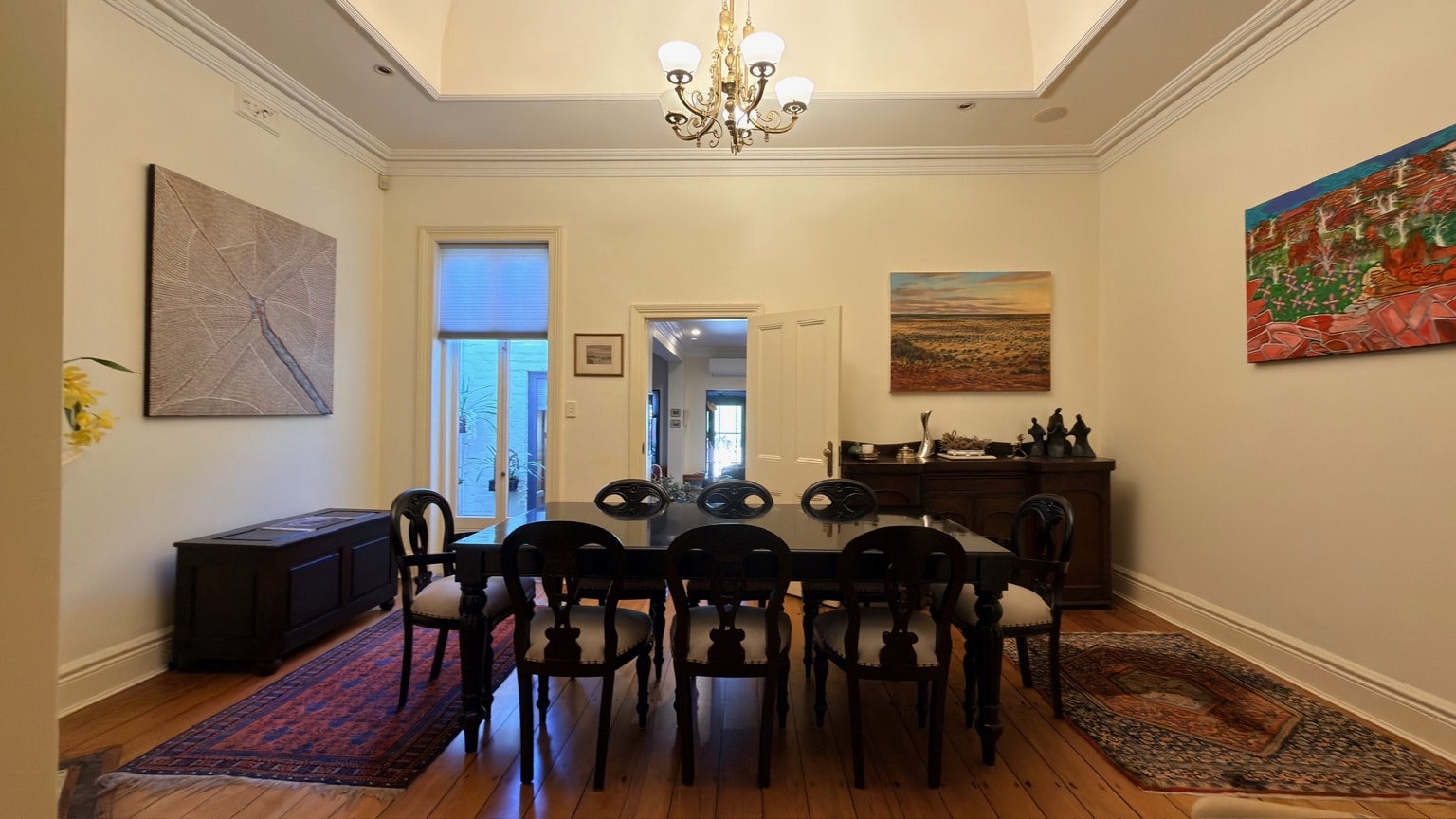 Front view of an assembled dining table and eight chairs in McMahons Point