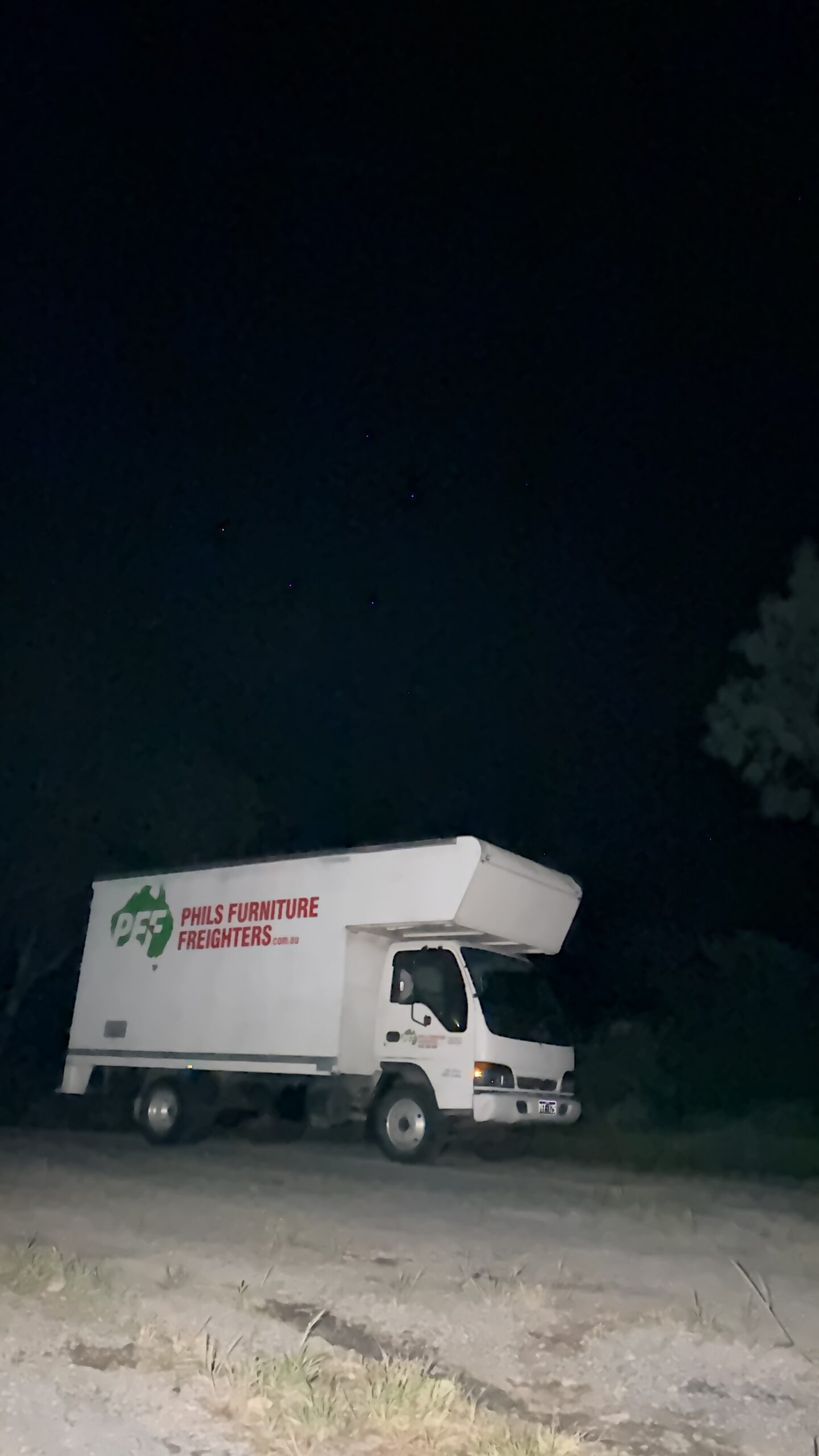 Phil’s Furniture Freighters truck parked at Woomargama at night.